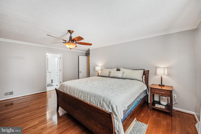 bedroom featuring wood-type flooring, crown molding, visible vents, and baseboards