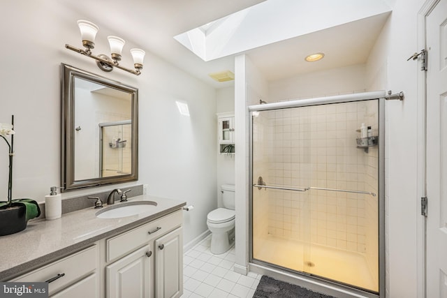 full bathroom featuring a skylight, a shower stall, toilet, and tile patterned floors