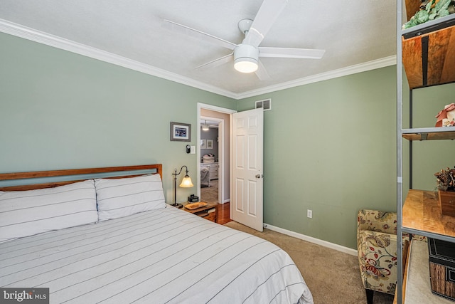 bedroom with carpet floors, baseboards, ornamental molding, and a ceiling fan