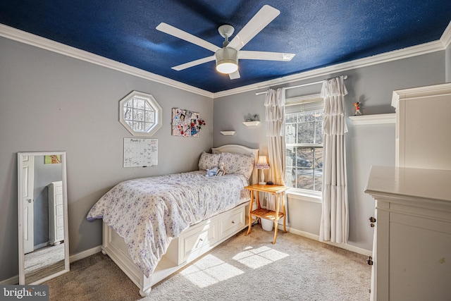 bedroom featuring carpet floors, ornamental molding, and a textured ceiling