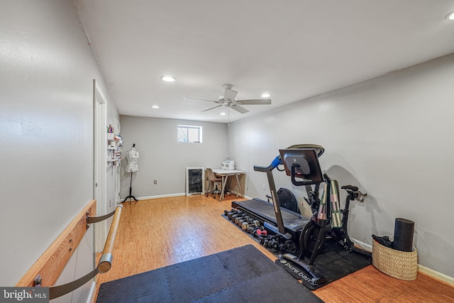 exercise area featuring recessed lighting, ceiling fan, baseboards, and wood finished floors