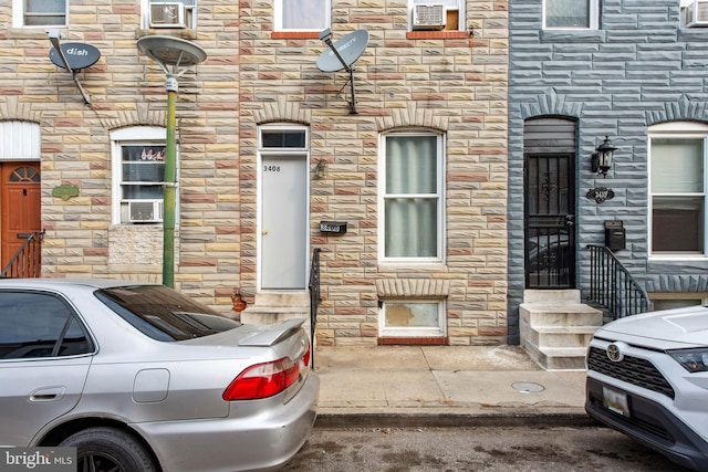 view of exterior entry with stone siding