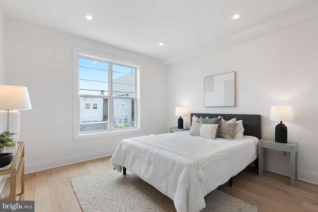 bedroom featuring light wood-type flooring, baseboards, and recessed lighting