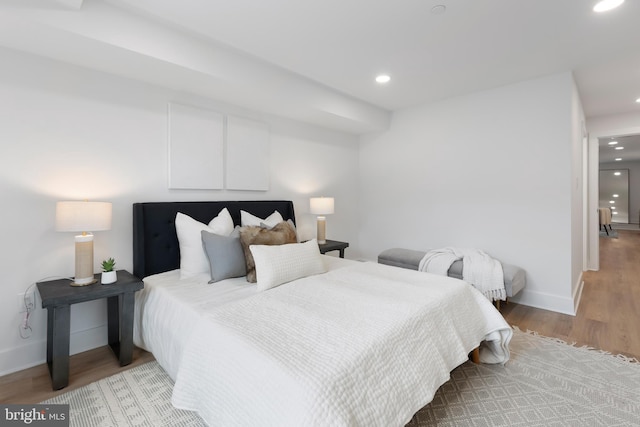 bedroom featuring recessed lighting, baseboards, and light wood finished floors