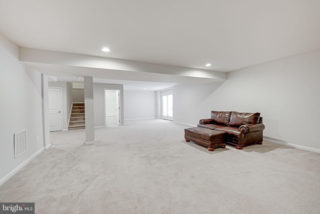 sitting room with visible vents, baseboards, recessed lighting, stairs, and light colored carpet