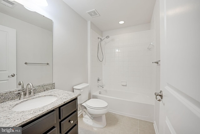 bathroom with visible vents, toilet, vanity, and tile patterned flooring