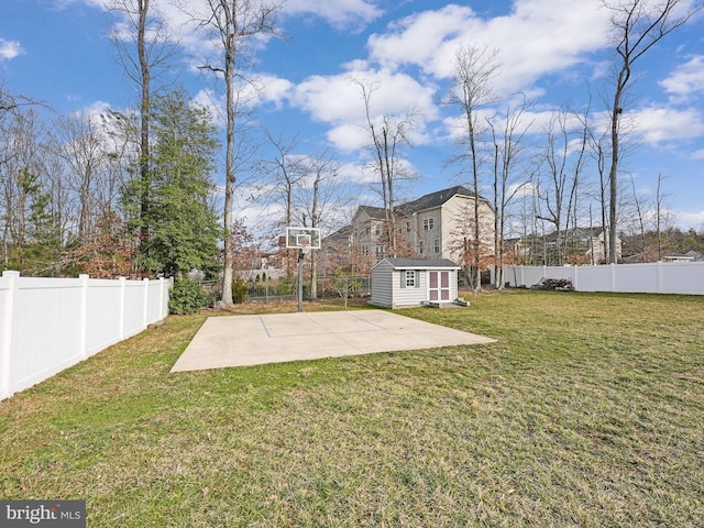 view of yard featuring a fenced backyard, a patio, an outbuilding, and a storage shed