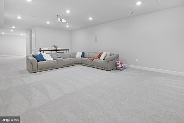 living area featuring baseboards, carpet floors, and recessed lighting