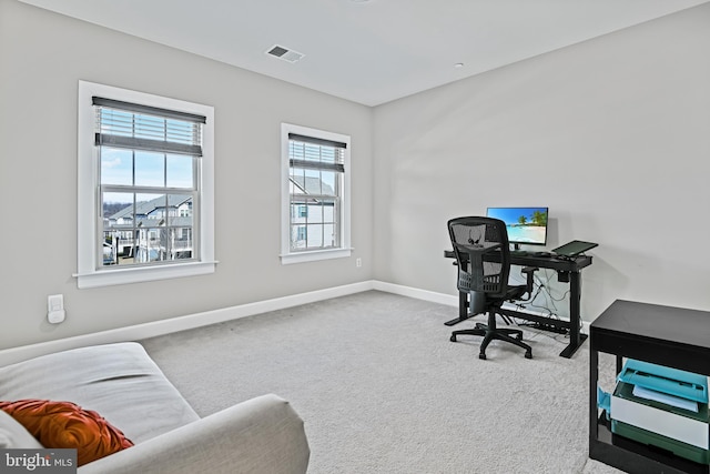 office with carpet, visible vents, and baseboards