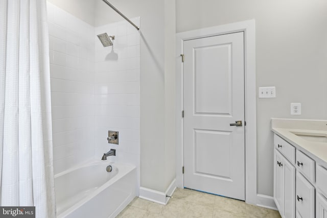 bathroom featuring baseboards, tile patterned flooring, vanity, and shower / tub combo with curtain