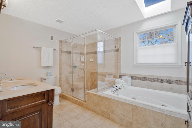 full bathroom with a stall shower, visible vents, toilet, a jetted tub, and a sink