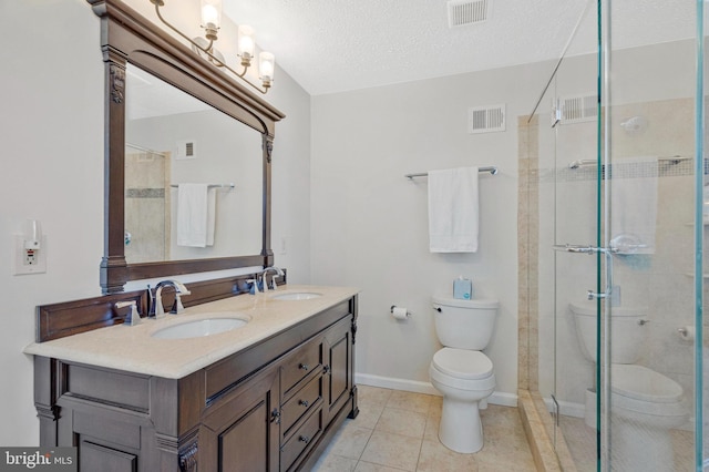 bathroom featuring toilet, a stall shower, visible vents, and a sink