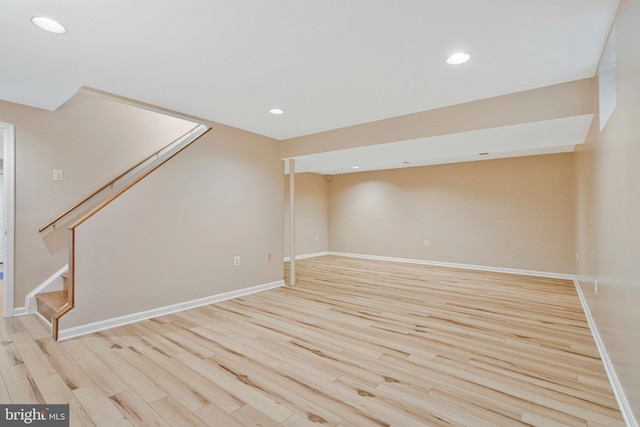 interior space with light wood-style floors, recessed lighting, stairway, and baseboards