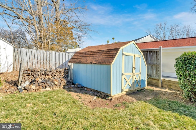 view of shed with a fenced backyard