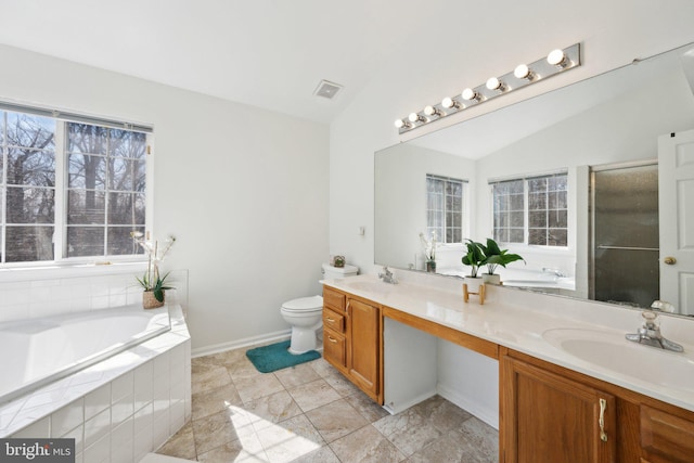 bathroom featuring vaulted ceiling, double vanity, a sink, and visible vents