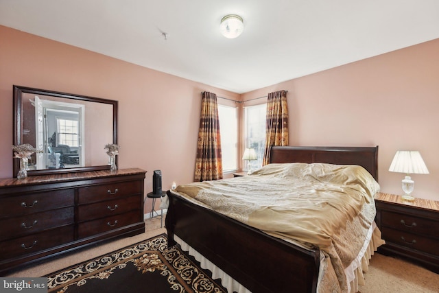 bedroom with light colored carpet