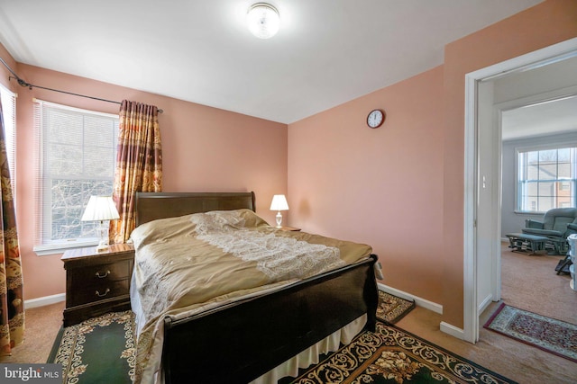 carpeted bedroom with baseboards