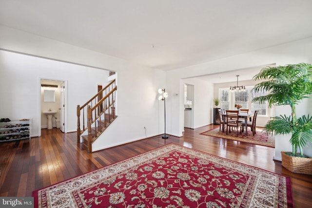 living room with hardwood / wood-style flooring and stairway