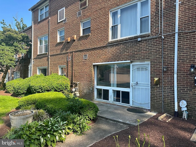 exterior space featuring brick siding