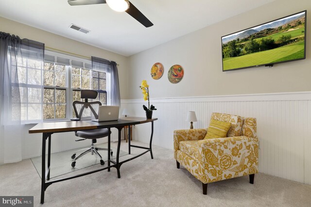 office area featuring visible vents, a ceiling fan, wainscoting, and carpet flooring