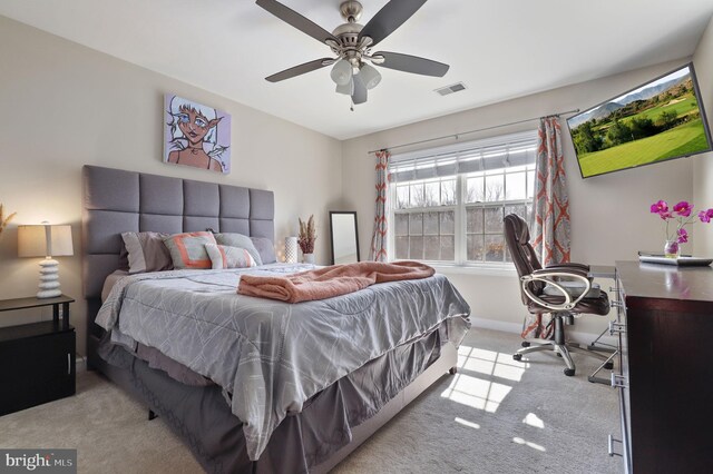 bedroom featuring visible vents, baseboards, carpet, and ceiling fan