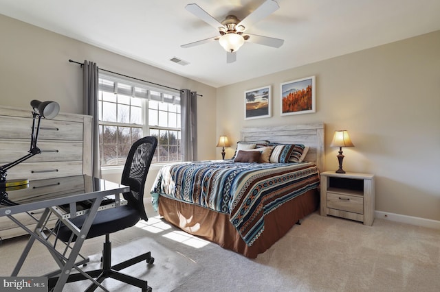 bedroom featuring visible vents, baseboards, light colored carpet, and ceiling fan