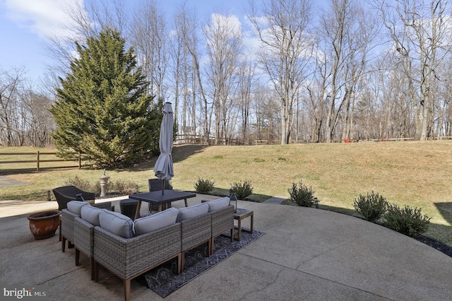 view of patio featuring fence and an outdoor hangout area