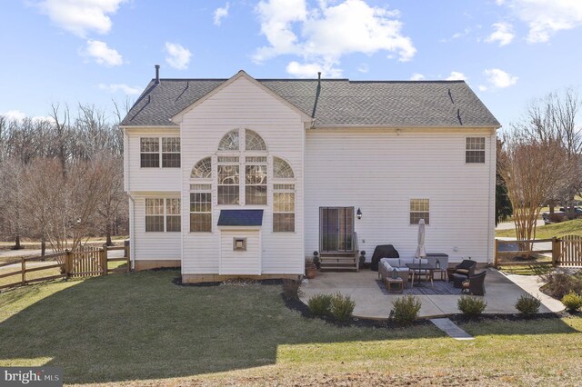 back of house with fence, a yard, a shingled roof, entry steps, and a patio area