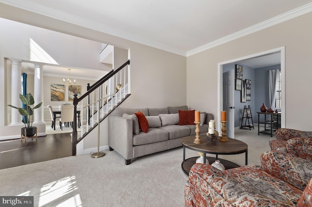 living room featuring baseboards, a chandelier, stairs, carpet floors, and ornamental molding