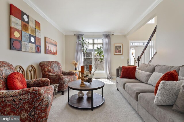 carpeted living room with stairs and ornamental molding