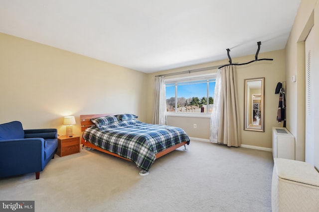 bedroom featuring carpet flooring and baseboards