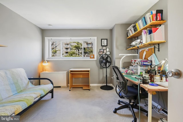 office space featuring baseboards and carpet floors