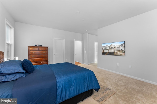 carpeted bedroom with baseboards