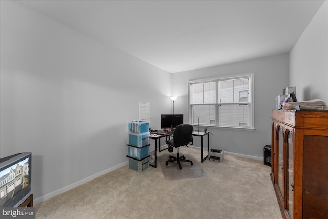 office with carpet flooring and baseboards