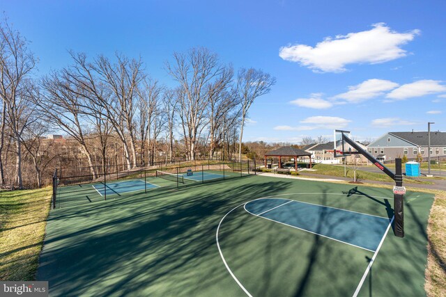 view of sport court with a gazebo, a tennis court, community basketball court, and fence