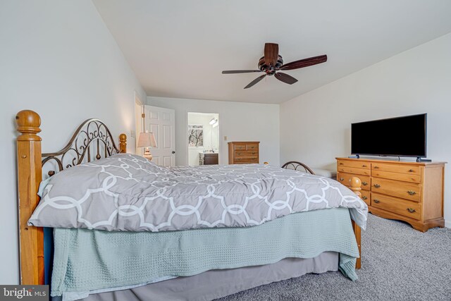 bedroom with carpet flooring, a ceiling fan, and connected bathroom