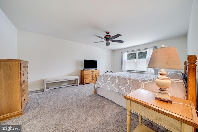 bedroom featuring light carpet and ceiling fan