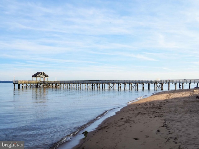 view of dock featuring a pier and a water view