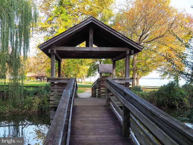 view of community featuring a gazebo and a water view