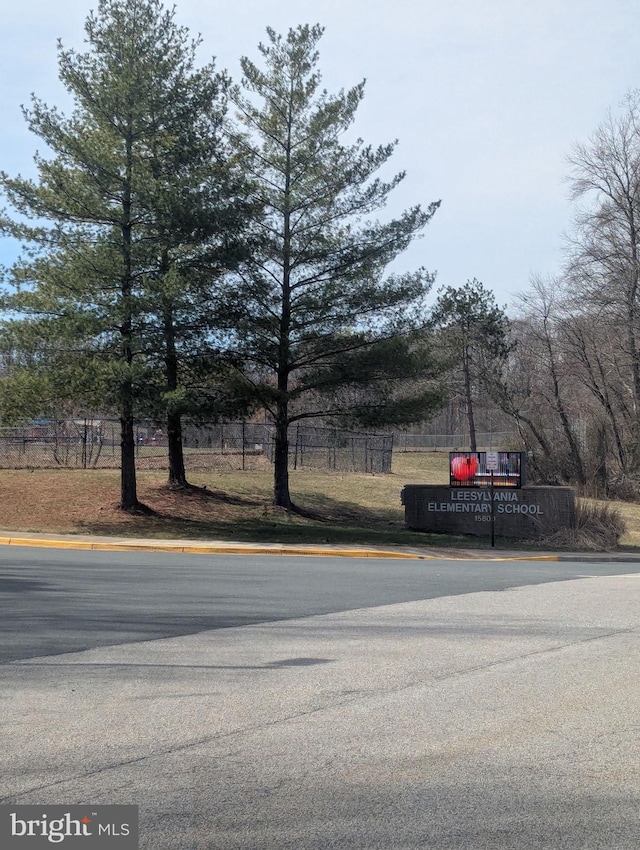 view of road featuring curbs