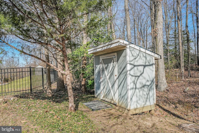 view of shed with fence