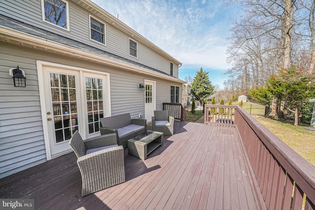 deck featuring an outdoor living space and fence