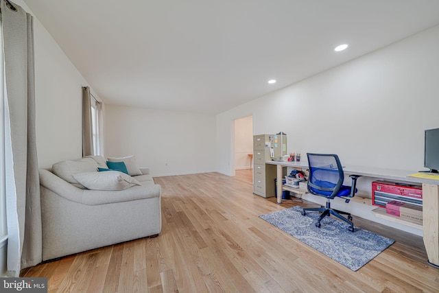 office with recessed lighting and wood finished floors