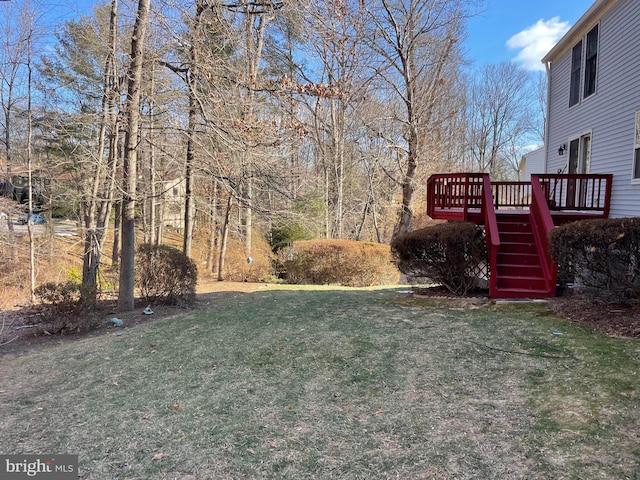 view of yard featuring stairway and a wooden deck