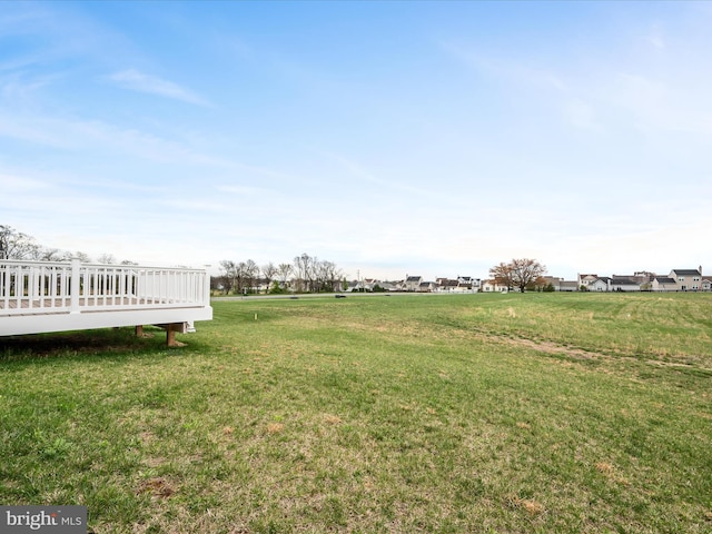 view of yard with a wooden deck