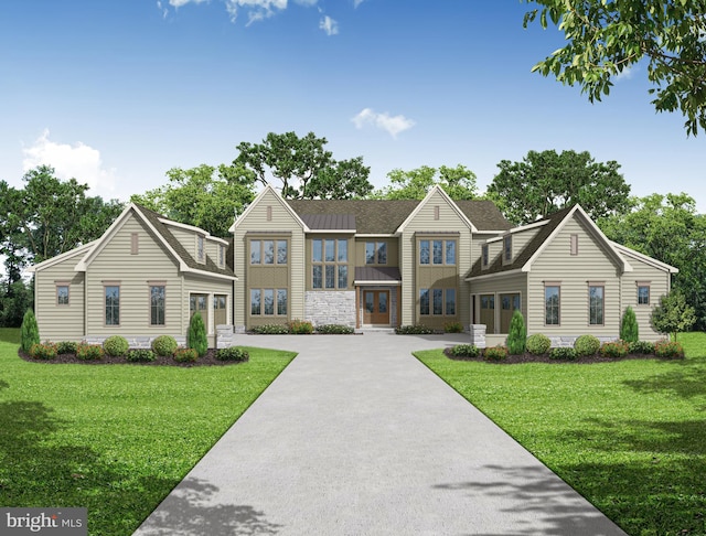 view of front facade featuring driveway and a front lawn