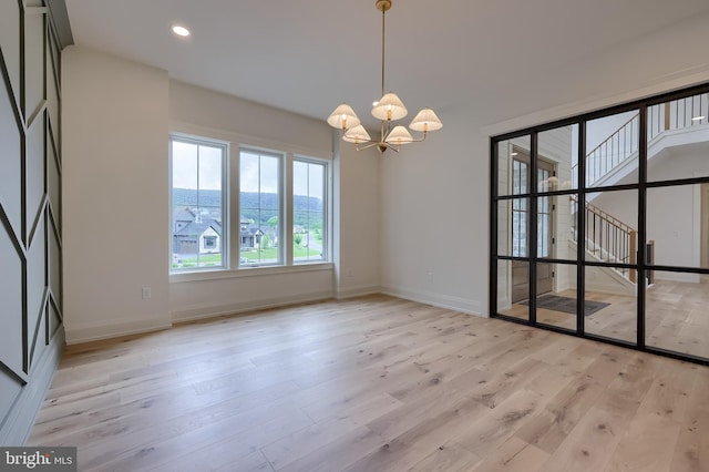 11 Sailfish Dr, Mechanicsburg, PA 17050 - spare room with a chandelier, light wood-style floors, and recessed lighting