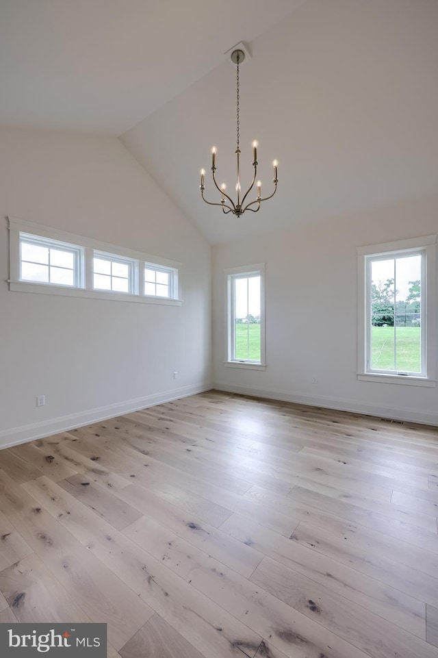 11 Sailfish Dr, Mechanicsburg, PA 17050 - unfurnished room with a chandelier, light wood finished floors, and high vaulted ceiling