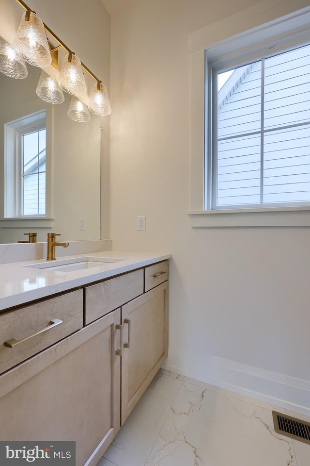 11 Sailfish Dr, Mechanicsburg, PA 17050 - bathroom featuring marble finish flooring, vanity, and plenty of natural light