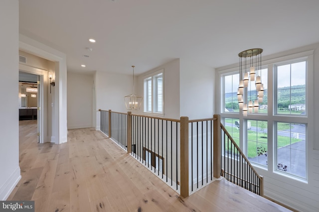11 Sailfish Dr, Mechanicsburg, PA 17050 - corridor with a chandelier, wood finished floors, an upstairs landing, and recessed lighting
